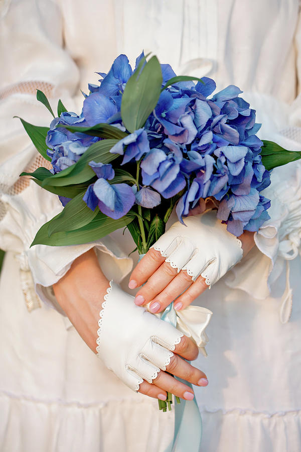 Hands With A Blue Hydrangea Photograph