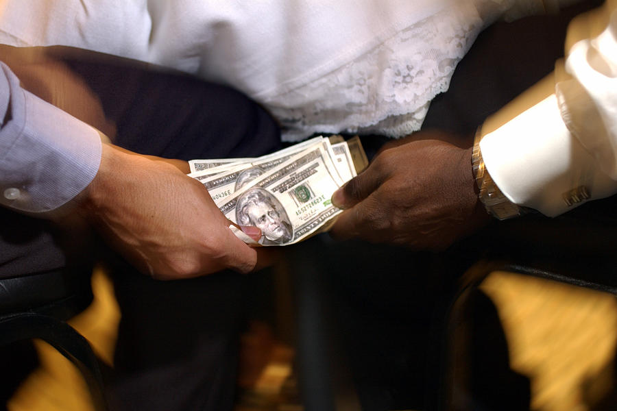 Hands with money Photograph by Thinkstock