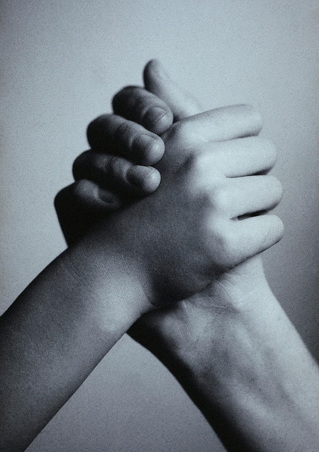 Handshake, b&w. Photograph by Laurent Hamels