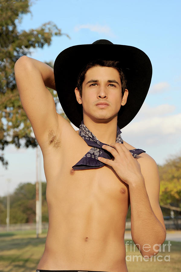 Handsome hispanic cowboy is wearing a black cowboy hat  Photograph by Gunther Allen