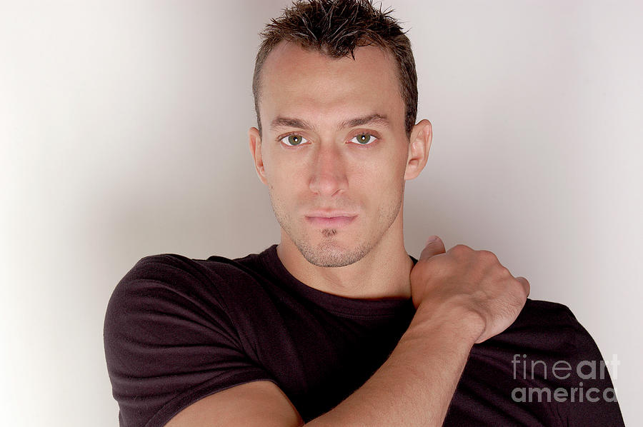 Handsome male model in a studio shot with a black t-shirt Photograph by Gunther Allen