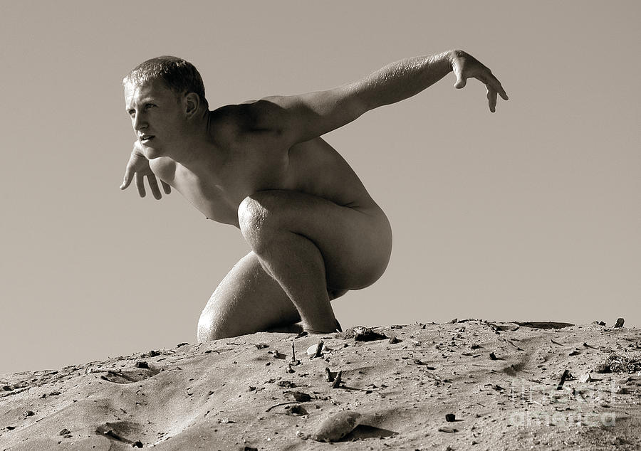 Handsome surfer stripped naked for photoshoot. Photograph by Gunther Allen