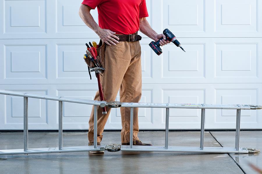 Handyman With Electric Drill Photograph by Spiderstock