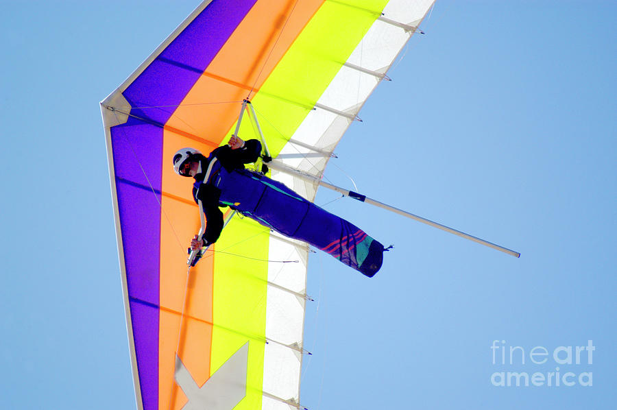 Hang Glider gliding on the breeze above the Pacific Ocean in San Diego.  Photograph by Gunther Allen