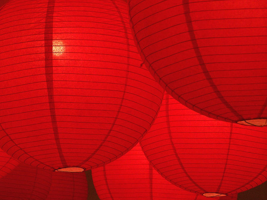 Hanging red paper lanterns glowing Photograph by Carrollphoto