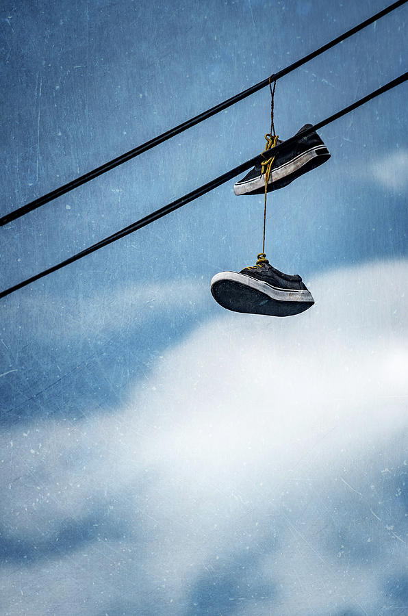 Hanging Used Neakers Photograph by Carlos Caetano