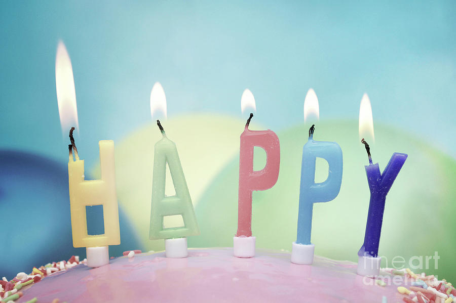 Vintage Photograph - Happy birthday candles on cake closeup, faded nostalgic concept. by Milleflore Images