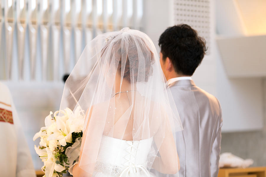 Happy bride and groom walking on virgin load Photograph by Satoshi-K