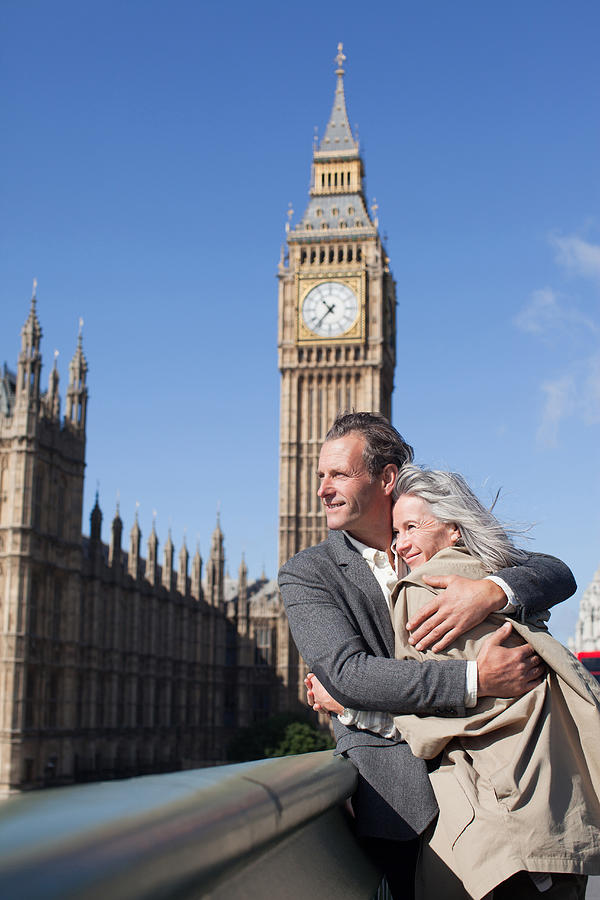 Happy couple hugging in front of Big Ben clocktower in London Photograph by Sam Edwards