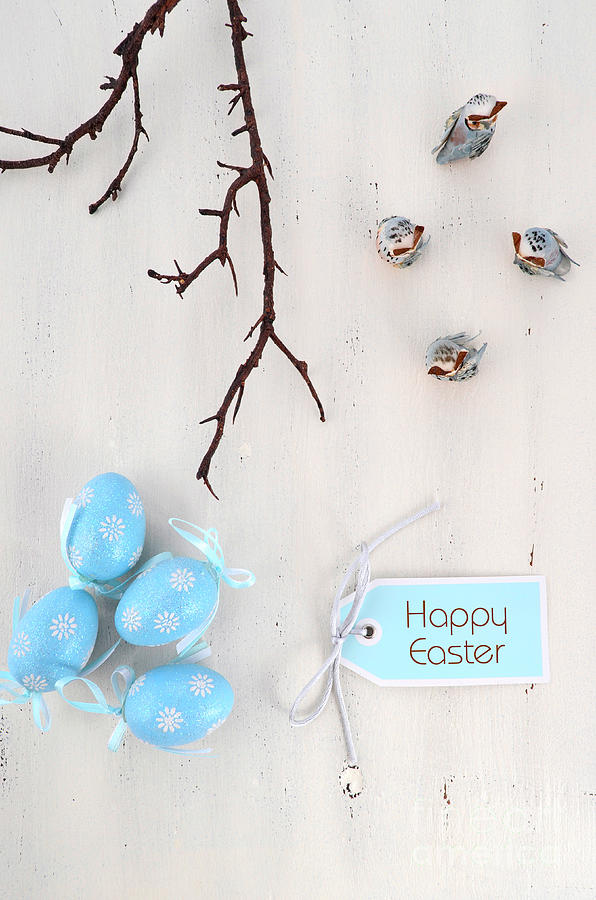 Happy Easter blue and white theme eggs on white wood table background.  Photograph by Milleflore Images