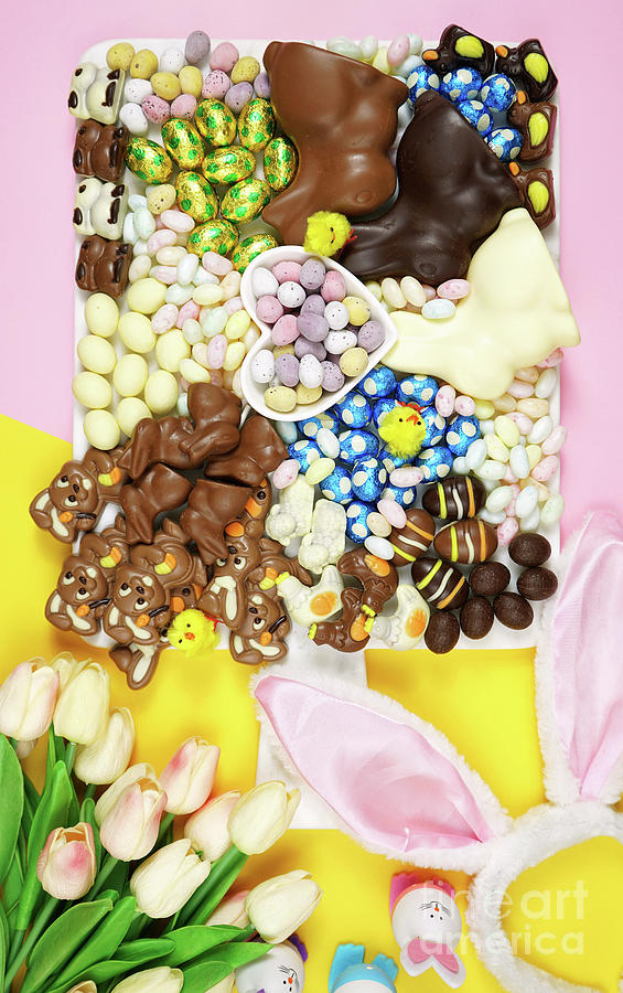 Happy Easter chocolate and candy eggs and bunnies grazing platter. Photograph by Milleflore Images