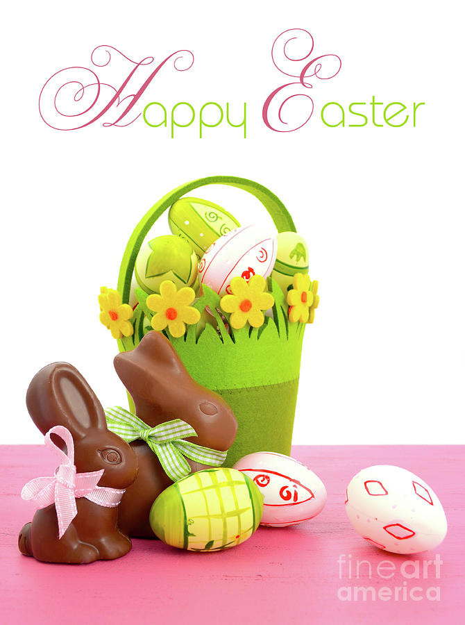 Happy Easter chocolate bunny rabbits with basket of pink, white and green eggs Photograph by Milleflore Images