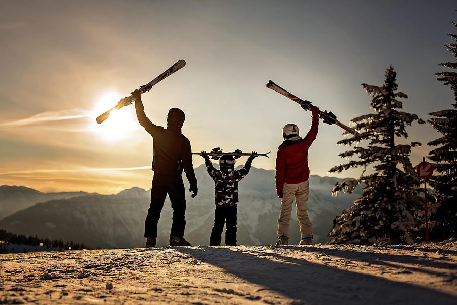 Happy family, mother, father and child, skiing on sunset in austrian Apls, beautiful scenery landscape Photograph by Tatyana Tomsickova Photography