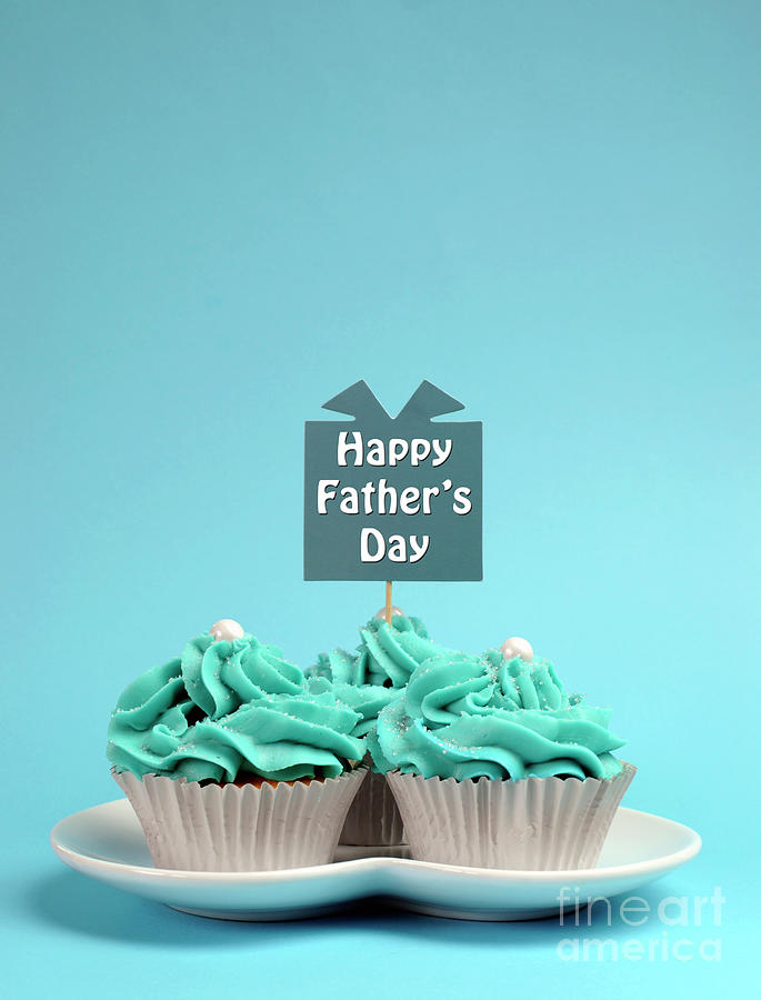 Happy Fathers Day special treat blue and white beautiful decorated cupcakes Photograph by Milleflore Images