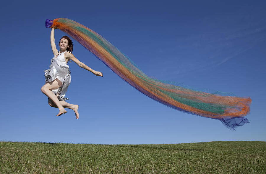 Happy Girl With Colorful Fabric Running, Jumping, Blue Sky Horizon Photograph by JamesBrey
