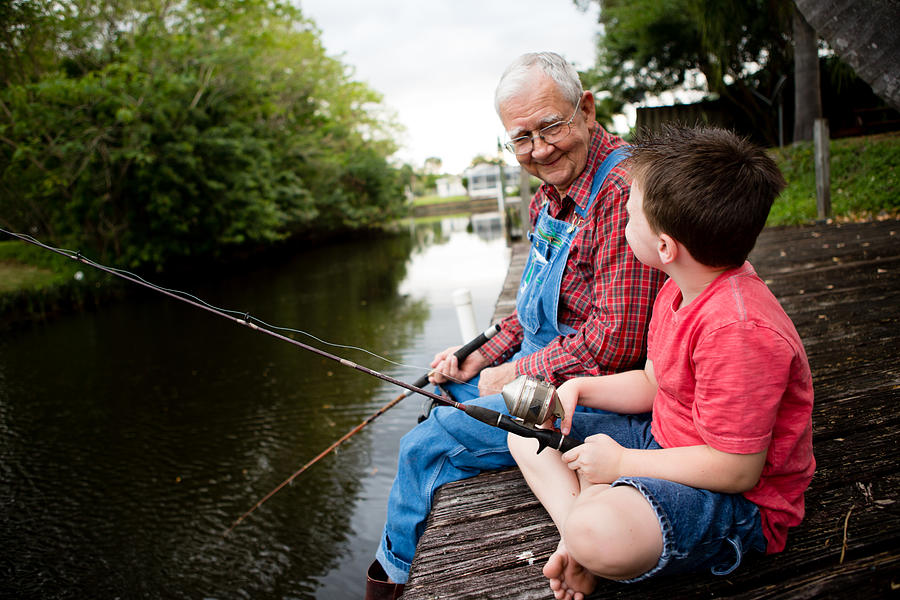 Happy Grandfather and Great Grandson Fishing Together Photograph by Ideabug