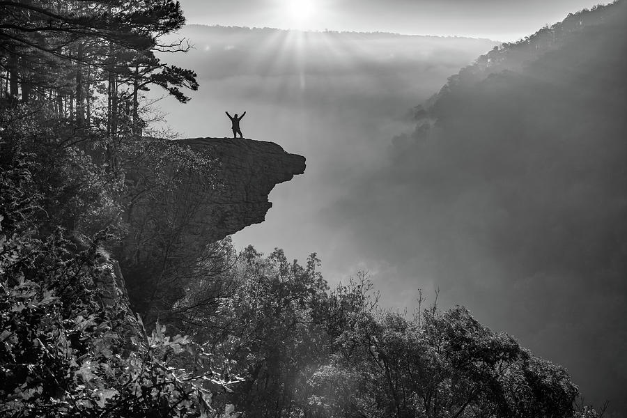 Black And White Photograph - Happy Hiker On Hawksbill Crag At Sunrise in Black and White by Gregory Ballos
