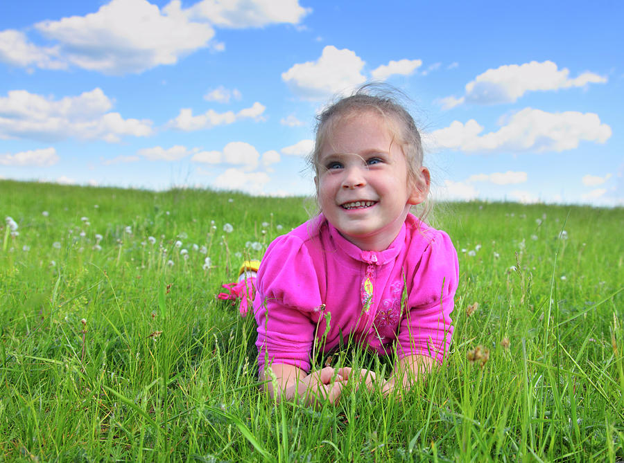 Happy Little Girl Lying On Grass Photograph by Mikhail Kokhanchikov ...