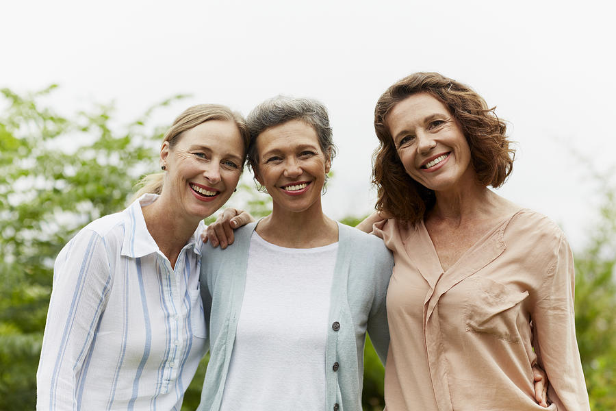 Happy mature women standing in park Photograph by Morsa Images