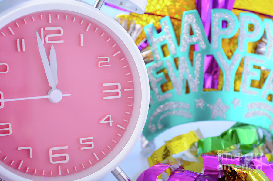 Happy New Year Clock and Party Decorations.  Photograph by Milleflore Images