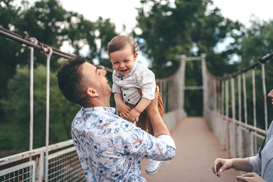 Happy photo father and child having fun outdoors Photograph by PhotoAttractive