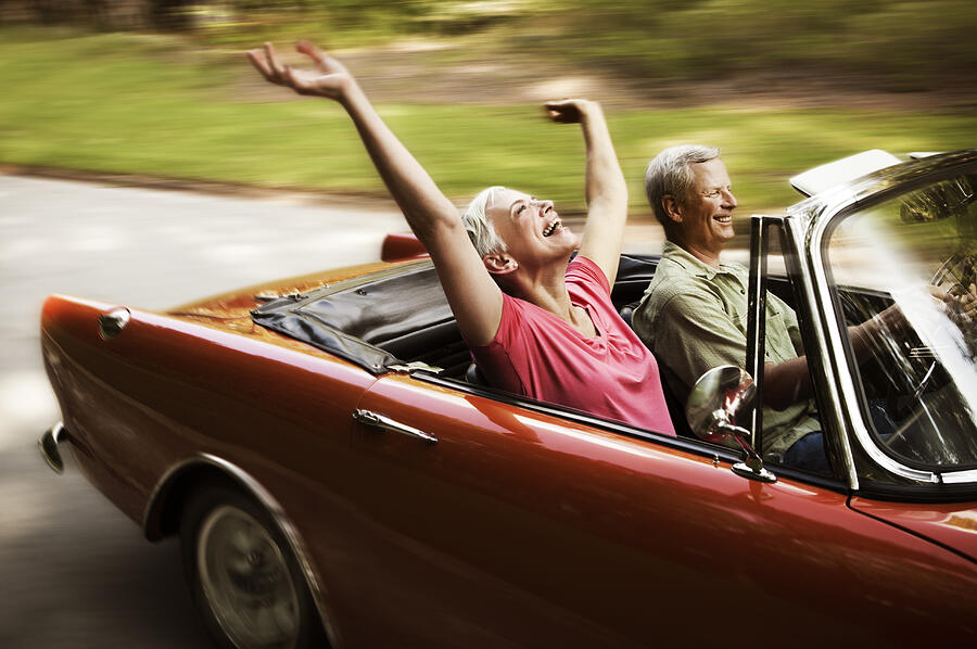 Happy Senior Couple Going For a Drive Photograph by Stevecoleimages