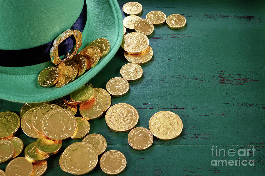 Happy St Patricks Day leprechaun hat with gold chocolate coins  Photograph by Milleflore Images