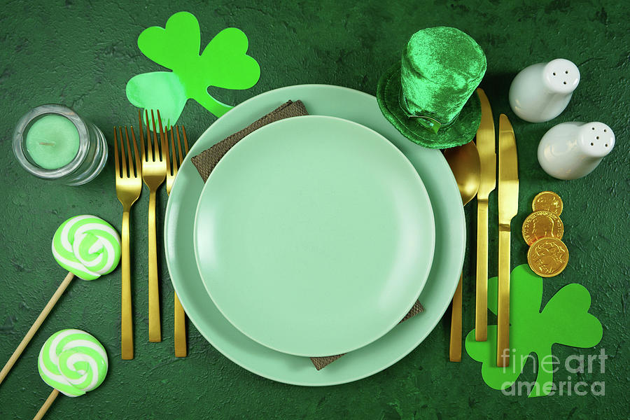 Happy St Patricks Day plates table setting flat lay. Photograph by Milleflore Images
