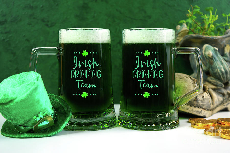 Happy St Patricks Day two green beer steins. Photograph by Milleflore Images