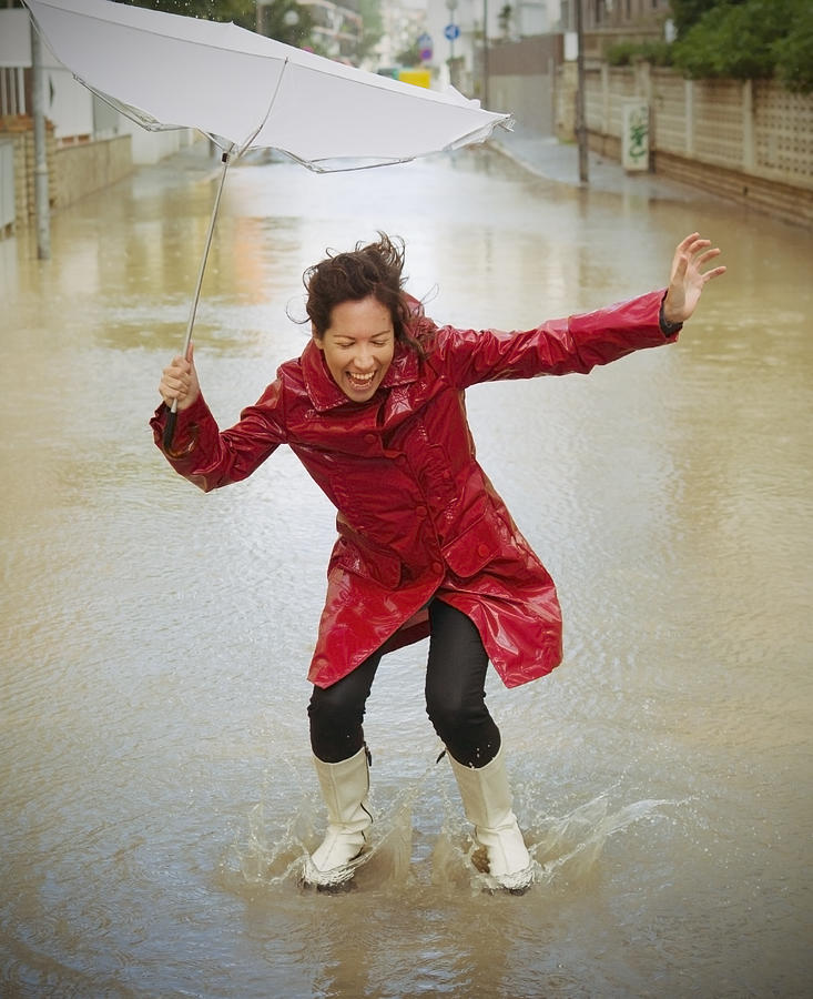 Happy woman in the rain Photograph by Rafael Elias