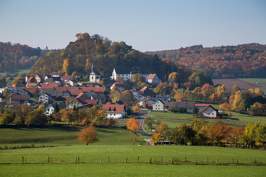 Haselstein village and trees with autumn foliage Photograph by Holger Leue