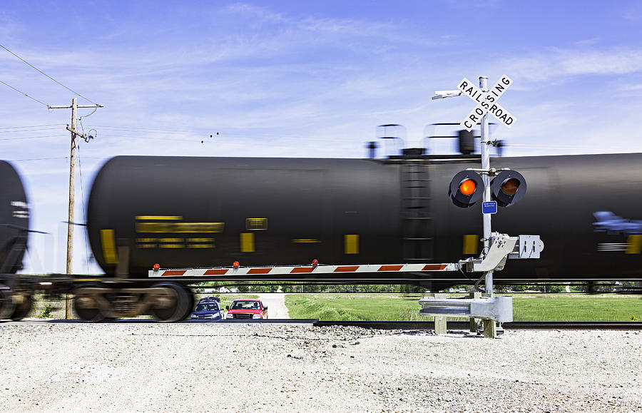 Hazardous rail freight passes crossing on rural road. Photograph by BeyondImages