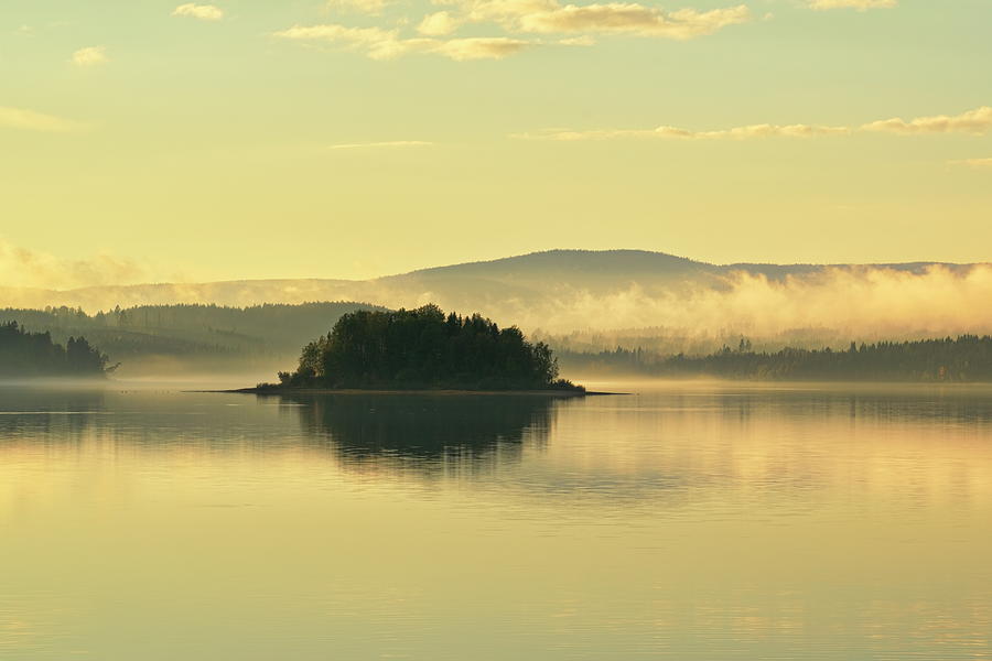 Hazy morning at a glassy lake with a small wooded island Photograph by Ulrich Kunst And Bettina Scheidulin