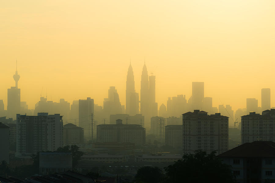 Hazy sunset in downtoen Kuala Lumpur Photograph by Shaifulzamri