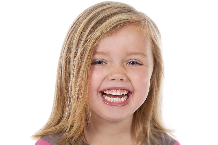Head And Shoulders Of Laughing Blond Girl On White Photograph by Jallfree