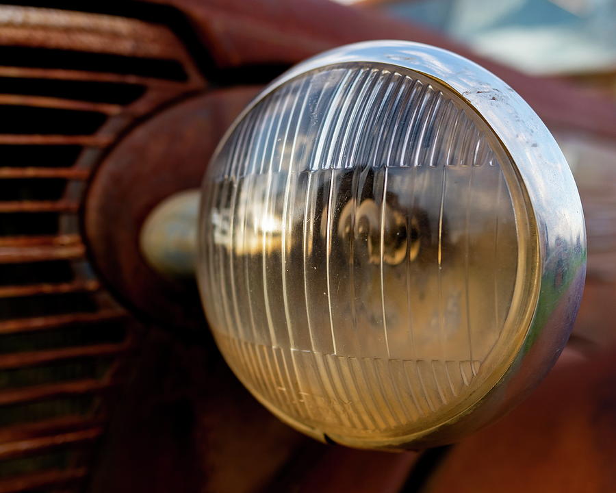 Headlight on an old Chevy truck Photograph by Art Whitton