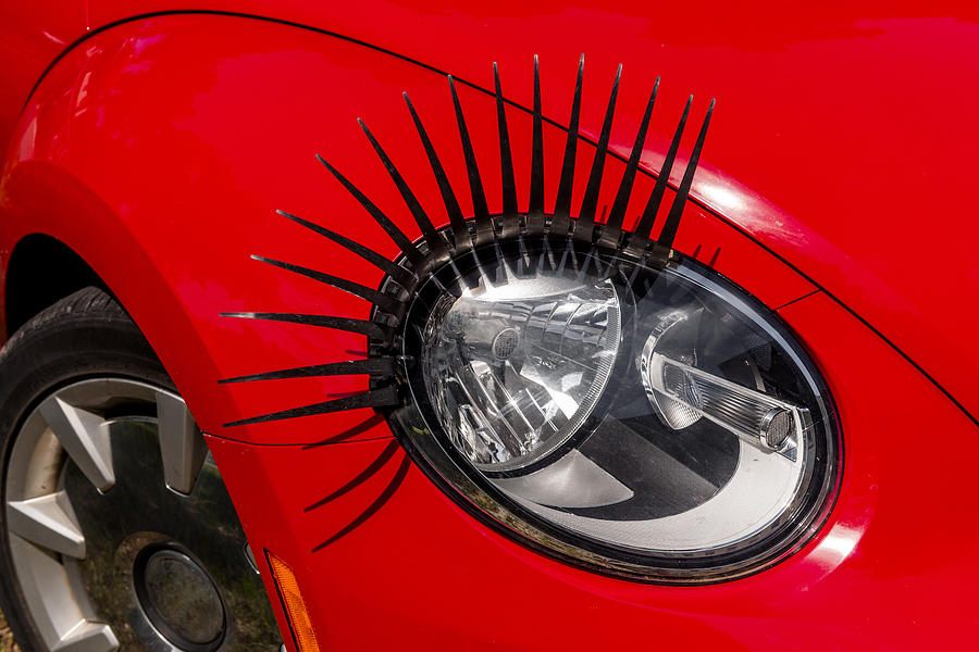 Headlight with eyelashes, close-up Photograph by Westend61