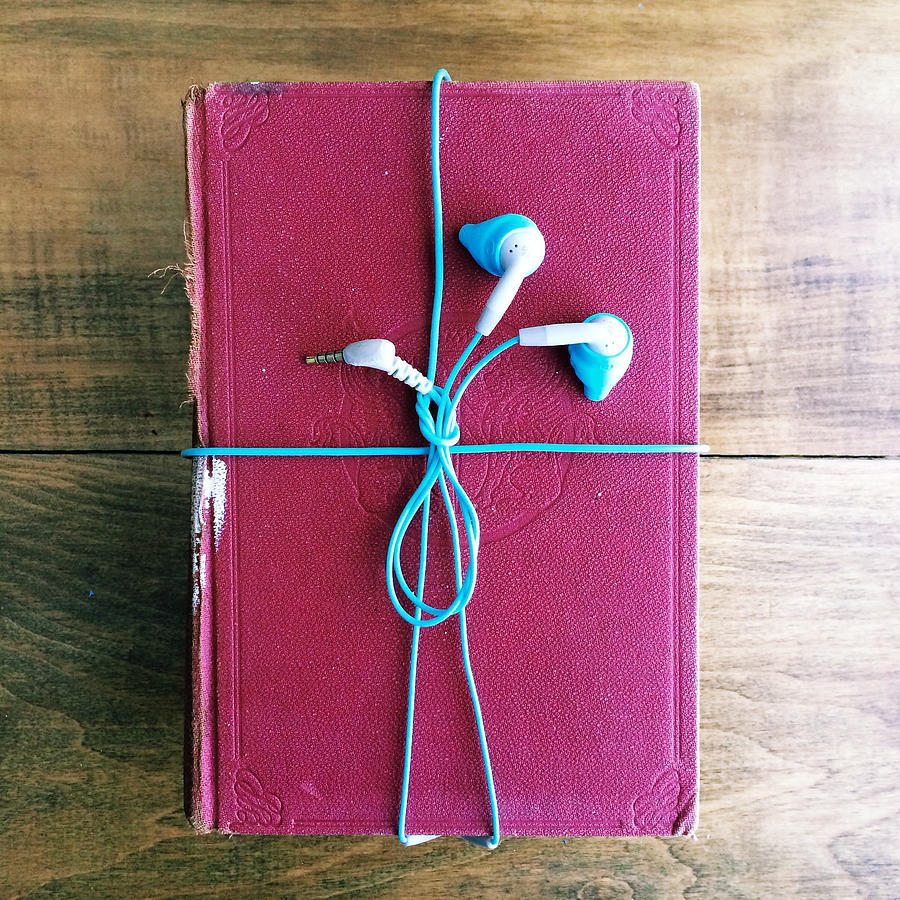 Headphones wrapped around an old book Photograph by Denistorm