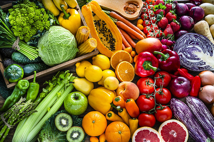 Healthy fresh rainbow colored fruits and vegetables background Photograph by Fcafotodigital