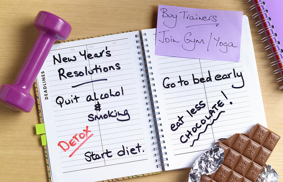 Healthy new years resolutions diary Photograph by Peter Dazeley