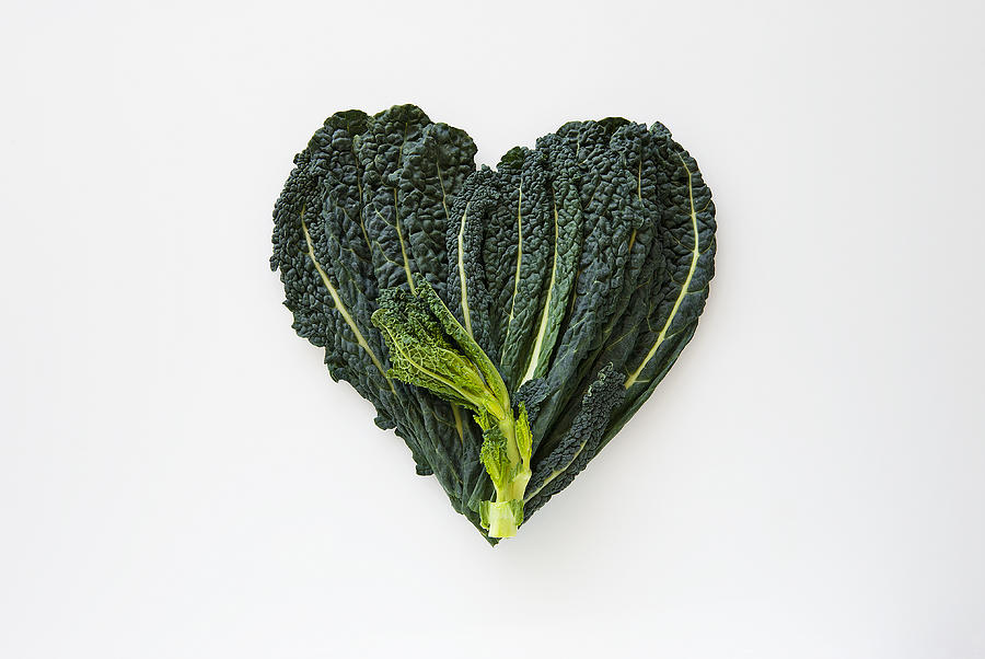 Heart-shaped formed by fresh Black Kale Photograph by Patrizia Savarese