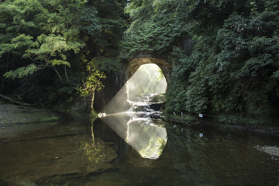 Heart-shaped Sunlight coming through a tunnel of the stream Photograph by K.Oka