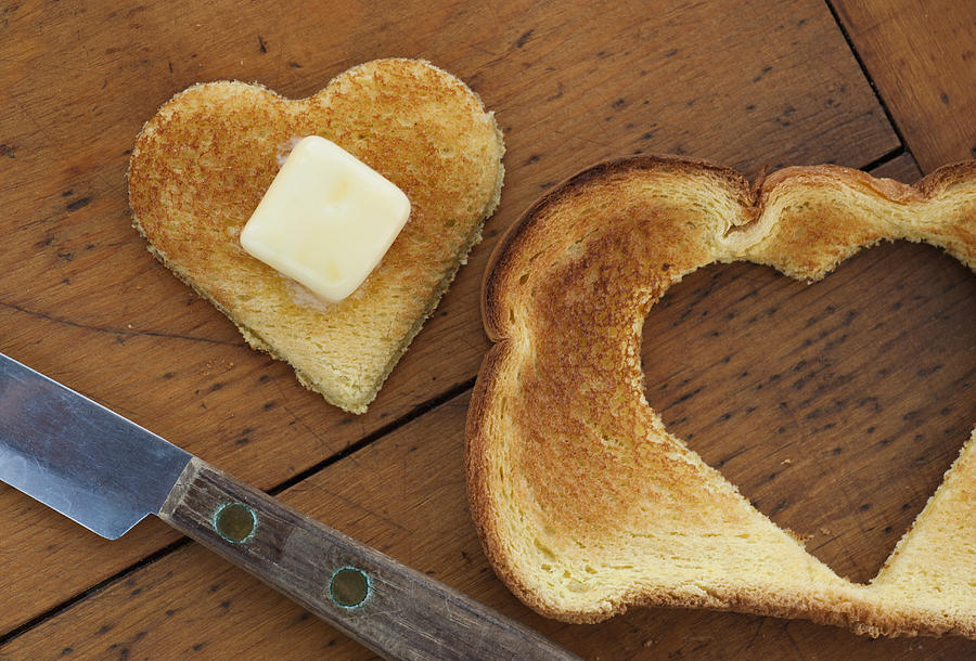Heart shaped toast on table Photograph by Tetra Images