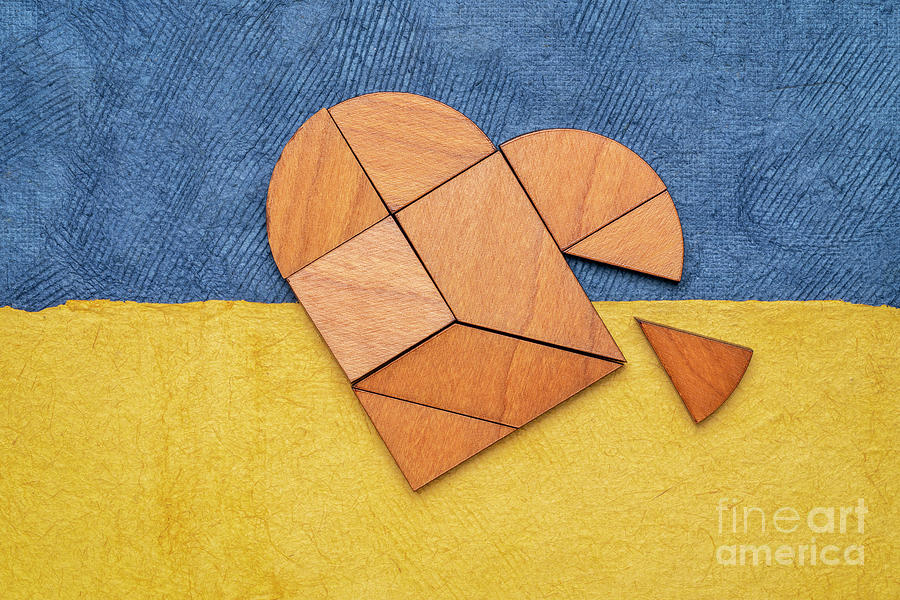 Heart Tangram Against Paper Abstract In Blue And Yellow Photograph by Marek Uliasz