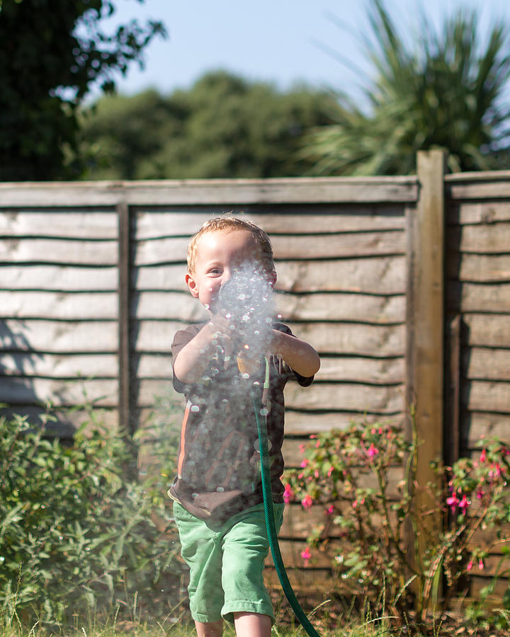 Heatwave - Watering the Garden Photograph by s0ulsurfing - Jason Swain