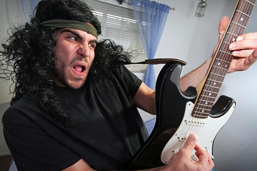 Heavy Metal Rocker in Bedroom with Electric Guitar Photograph by RyanJLane