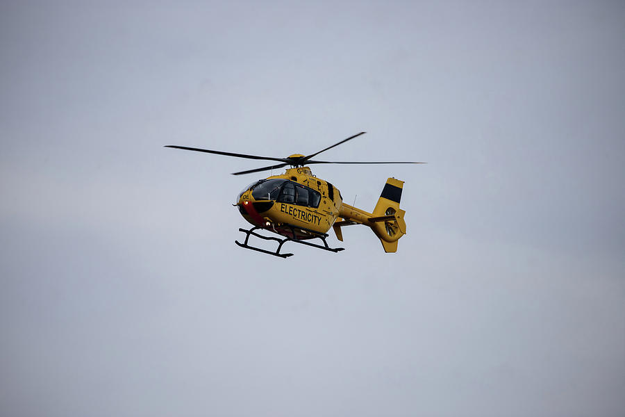 Helicopter - G-WPDE over Bristol Airport Photograph by Colin Peachey