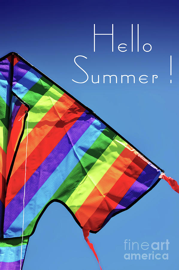 Hello Summer sample text with bright colorful kite flying high over blue sky. Photograph by Milleflore Images