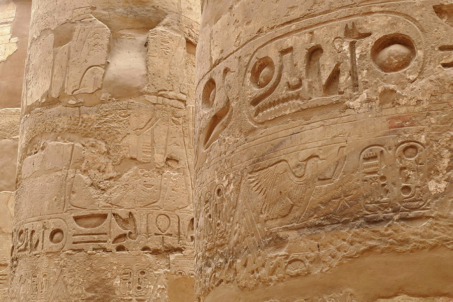 Hieroglyphics on massive columns of Karnak Photograph by Steve Estvanik