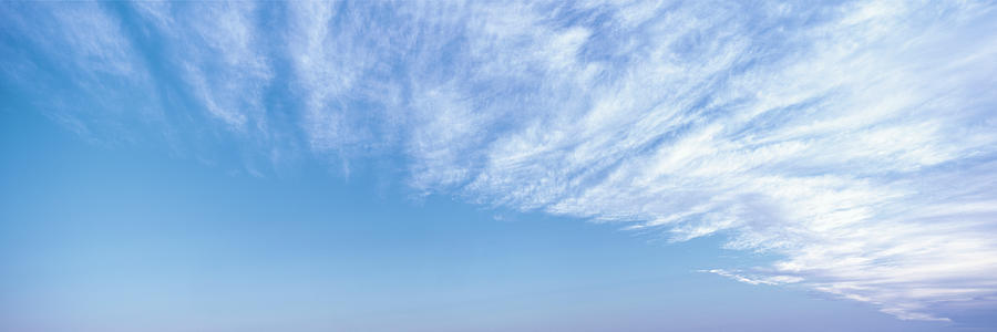 High altitude cirrus clouds fan out like feathers in the sky above Loreto, Baja California Sur, Mexi Photograph by Panoramic Images
